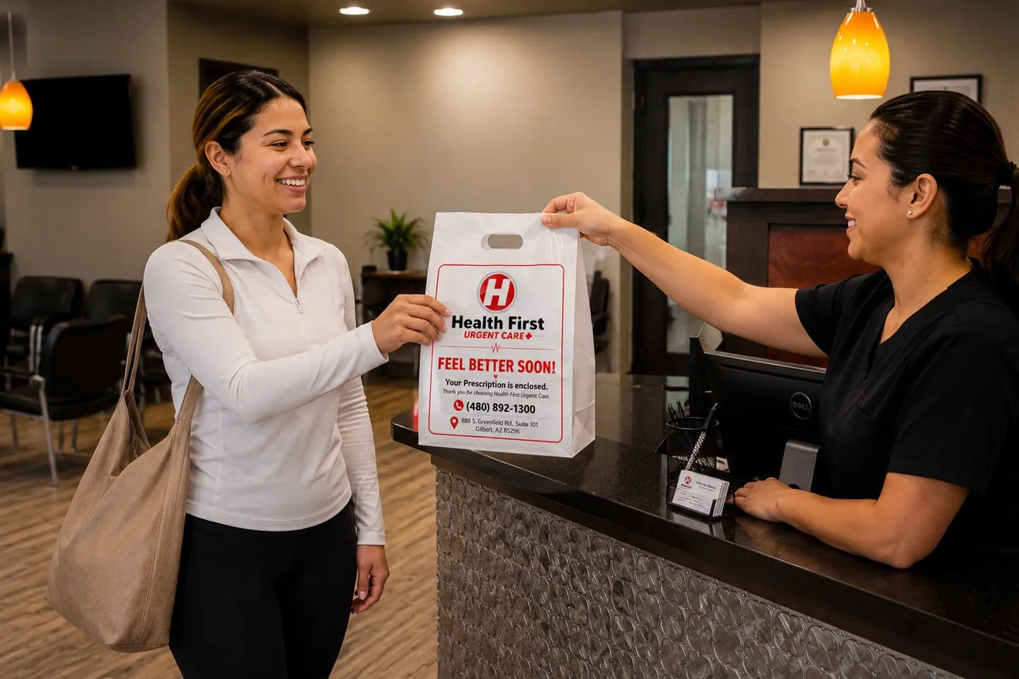 A Health First team member handing a branded prescription bag across the front desk to a smiling patient